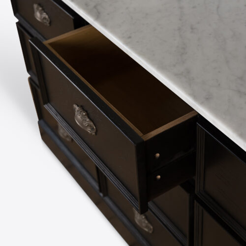 bank of drawers in black oak with a Carrara marble top