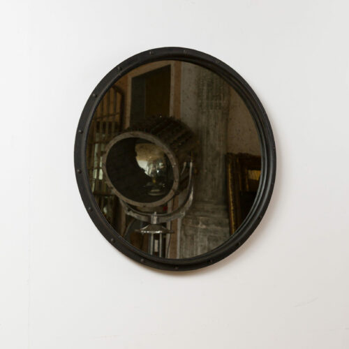 round aged glass mirror with industrial black frame
